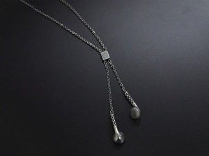 Detail of vintage silver titanium steel hip-hop necklace with retro headphone pendant