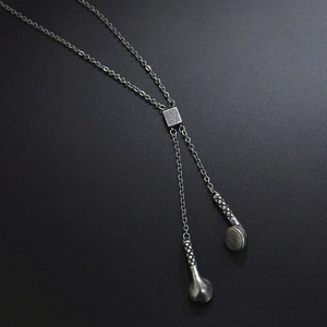 Silver stainless steel hiphop headphone pendant necklace on a sleek black background