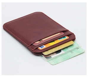 Detailed close-up showing the interior slots of this slim reddish-brown leather card holder