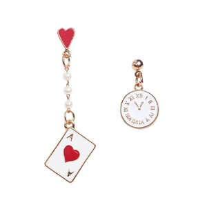 Asymmetric earrings featuring poker card, clock dial, and pearl accents in gold finish