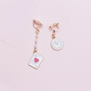 Detail of asymmetric Alice earrings with poker card, clock charm and faux pearls
