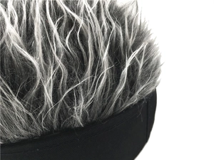 Detailed macro view of high-density synthetic gray hair strands on a docker hat brim