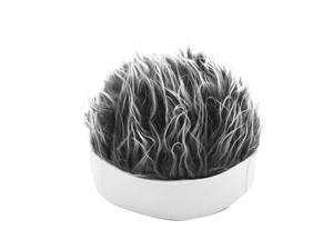 Detail of creative visor cap with short spiky grey wig fibers on a white fabric base