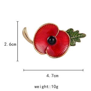 Red enamel poppy flower brooch pin with sparkling rhinestones on golden base