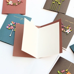 Handmade greeting cards with 3D wooden motifs on brown and green cardstock