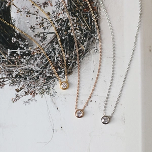 Classic 18K gold plated titanium necklaces with sparkling solitaire zircon pendants