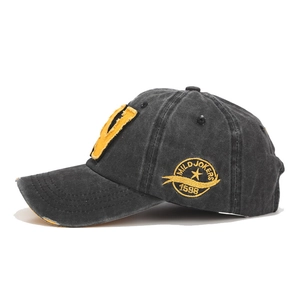 Vintage washed cotton baseball cap with yellow V embroidery in distressed black finish