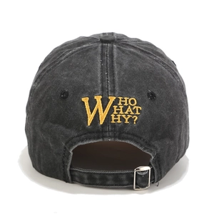 Rear view of washed black baseball cap with yellow W embroidery and metal buckle strap