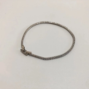 Detailed top view of a classic silver tennis bracelet with round clear zircon stones