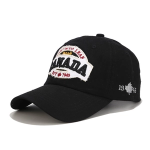 Detailed view of Canada Toronto embroidery and maple leaf patch on black cotton cap