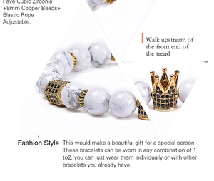 Detail of 8mm white turquoise beads with gold crown and cubic zirconia charms