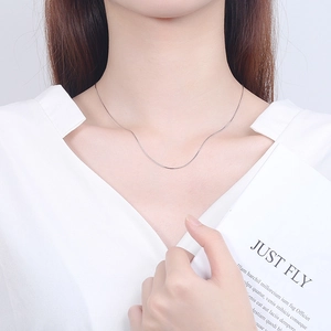 Elegant 925 sterling silver minimalist snake chain necklace worn by a female model