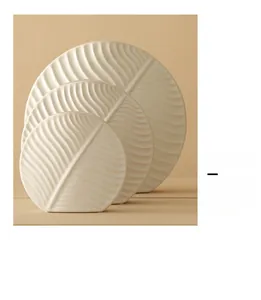 Set of 3 matte white ceramic leaf sculptures with realistic vein texture for home decor