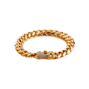Iced out cuban link chain bracelet in gold finish with crystal encrusted buckle