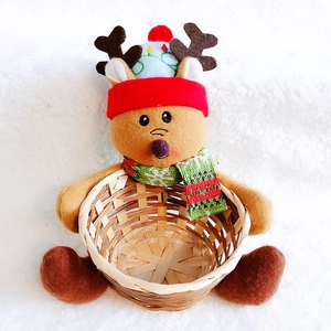Front detail of a plush reindeer Christmas candy basket made of woven wood material