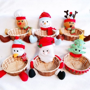 Detailed view of assorted plush Christmas Santa and snowman bamboo storage candy baskets
