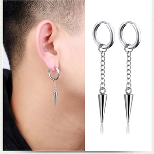 Detail view of punk silver steel earrings with long chain and cone spike pendant