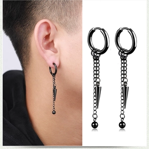 Detail of black punk tassel chain earrings with cone pendants in stainless steel
