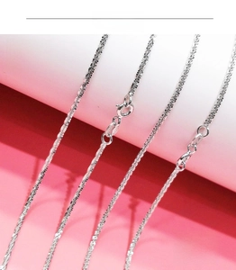 Detailed close-up of sparkling S925 sterling silver chain with secure spring clasp