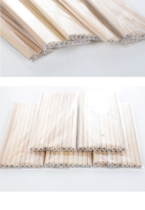 Close-up of bulk hexagonal raw wood HB pencils packaged in clear plastic bags