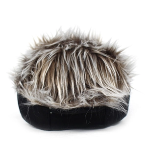 Detailed shot of a black baseball cap featuring spiky brown-grey synthetic faux hair texture