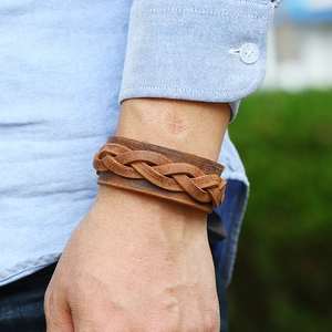 Vintage brown braided leather cuff bracelet for men with a wide retro ethnic design