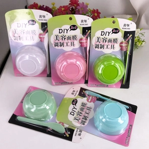 Macro detail of DIY facial mask mixing bowl and spatula sets in assorted macaron colors