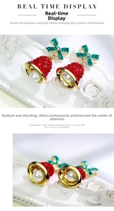 Macro detail of Christmas bell earring with red rhinestones and green crystal bow knot