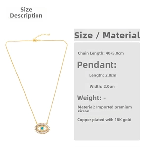 Macro detail of 18K gold plated copper evil eye pendant necklace with cubic zirconia