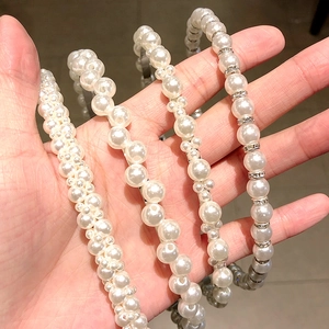 Handmade pearl headbands set with four unique designs featuring elegant white faux pearls
