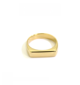Close-up of 18K gold plated wide signet ring showing thick plating and high polish finish