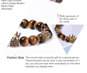 Macro detail of natural tiger eye beads and crown charm with zircon inlay