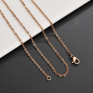 Detailed shot of a rose gold stainless steel O-chain with a secure lobster clasp