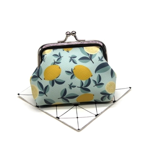 Cute lemon print coin purse featuring a stylish silver kiss-lock metal frame closure