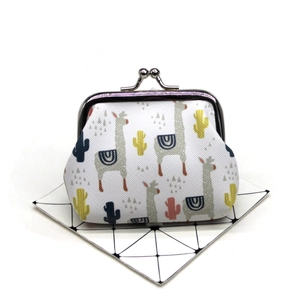 Close-up of cute alpaca print coin purse with secure vintage silver kiss-lock closure