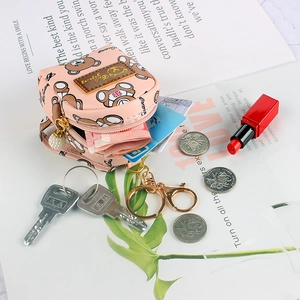 Pink cartoon bear mini coin purse with gold keychain and pearl charm accessory