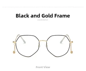 Front view of black and gold polygonal glasses frames with star chain pendant detail