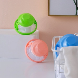 Floating washing machine lint filter bags in blue pink and green for laundry hair removal