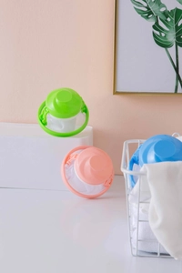 Three floating lint mesh bags for washing machines in green, pink and blue colors