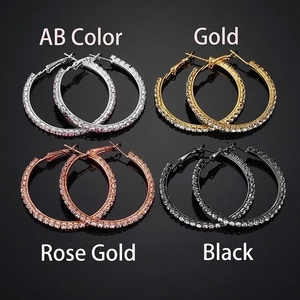 Chic oversized hoop earrings set in silver, gold, rose gold and black with crystal pavé