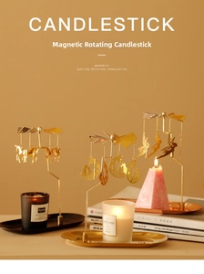 Detail of magnetic rotary candlestick with golden unicorn and fairy charms in motion