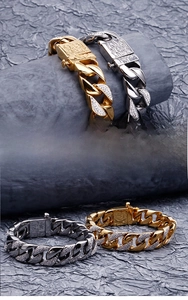 Detailed macro view of cuban link bracelet clasp featuring fine zircons and embossed textures