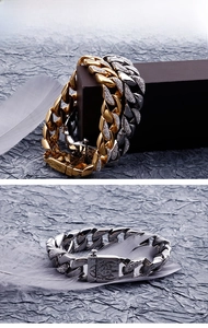 Detail of heavy gold and silver Cuban link bracelets with micro-pave diamond accents