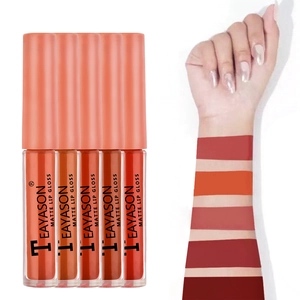 Arm swatches of five matte lip gloss shades ranging from nude to dark red colors