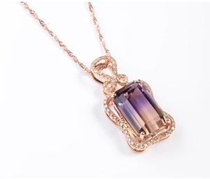 Detail of amethyst necklace pendant with rose gold finish and pavé setting