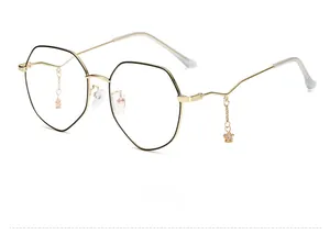 Side view of gold polygon glasses frames with star and bear pendant chain accessories