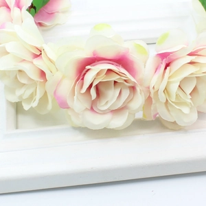 Detail of handmade bridal flower crown with silk roses in white and soft pink tones