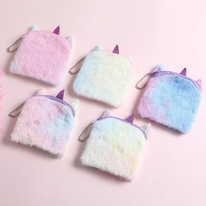 Set of five plush unicorn coin purses with pastel tie-dye colors and metal bead chains