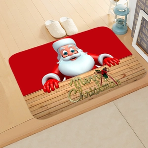 Detail of Christmas doormat with Santa Claus and golden Merry Christmas text