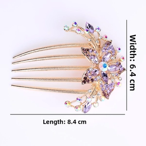 Detailed view of alloy hair comb with purple rhinestones and 6.4cm x 8.4cm dimensions